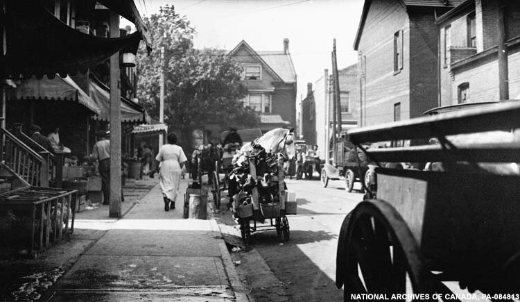 Baldwin Street in 1922, now complete with motorized trucks. - Photo courtesy: National Archives of Canada, PA-084813